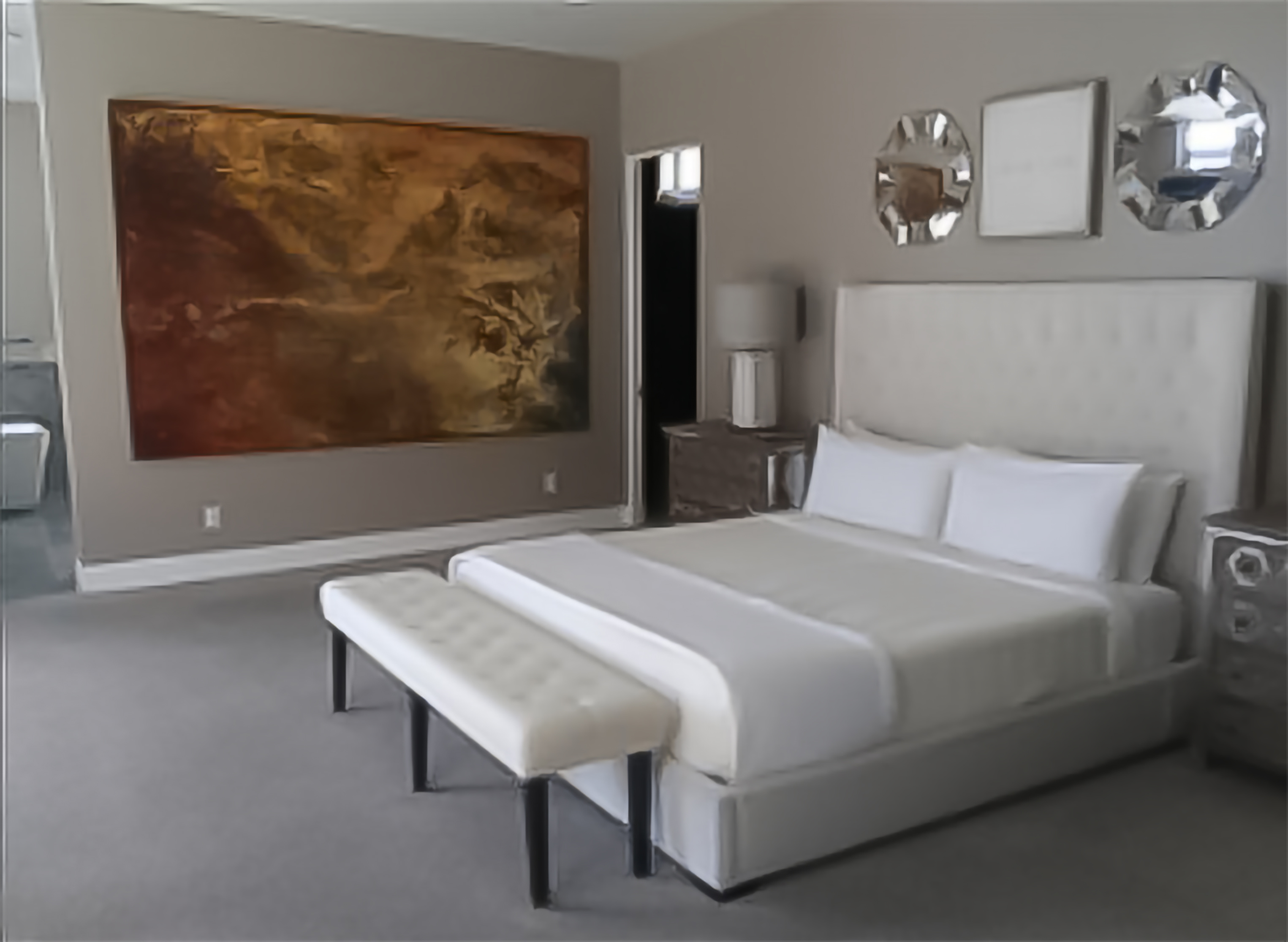 Immaculate luxury master bedroom with artwork — vacation rental cleaning